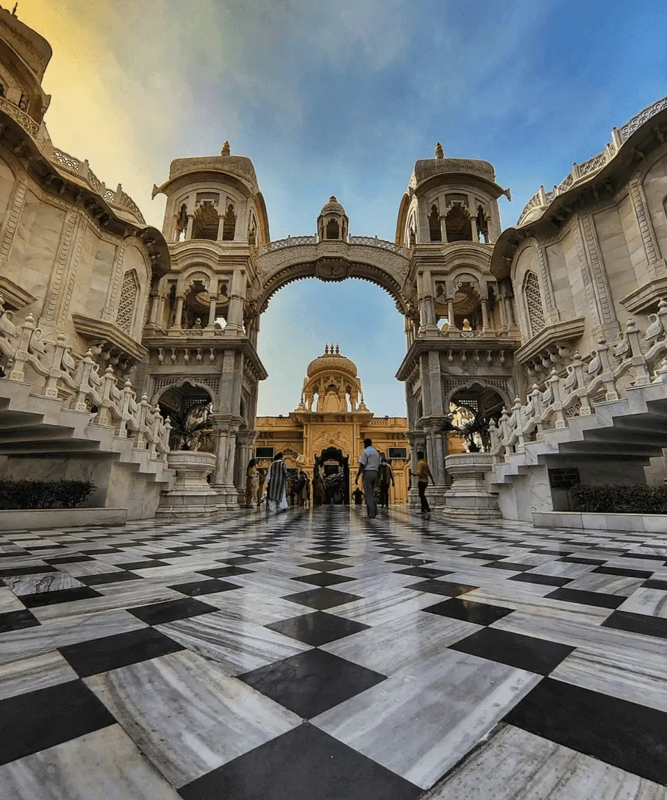 ISKCON Temple Vrindavan white marble architecture surrounded by pilgrims